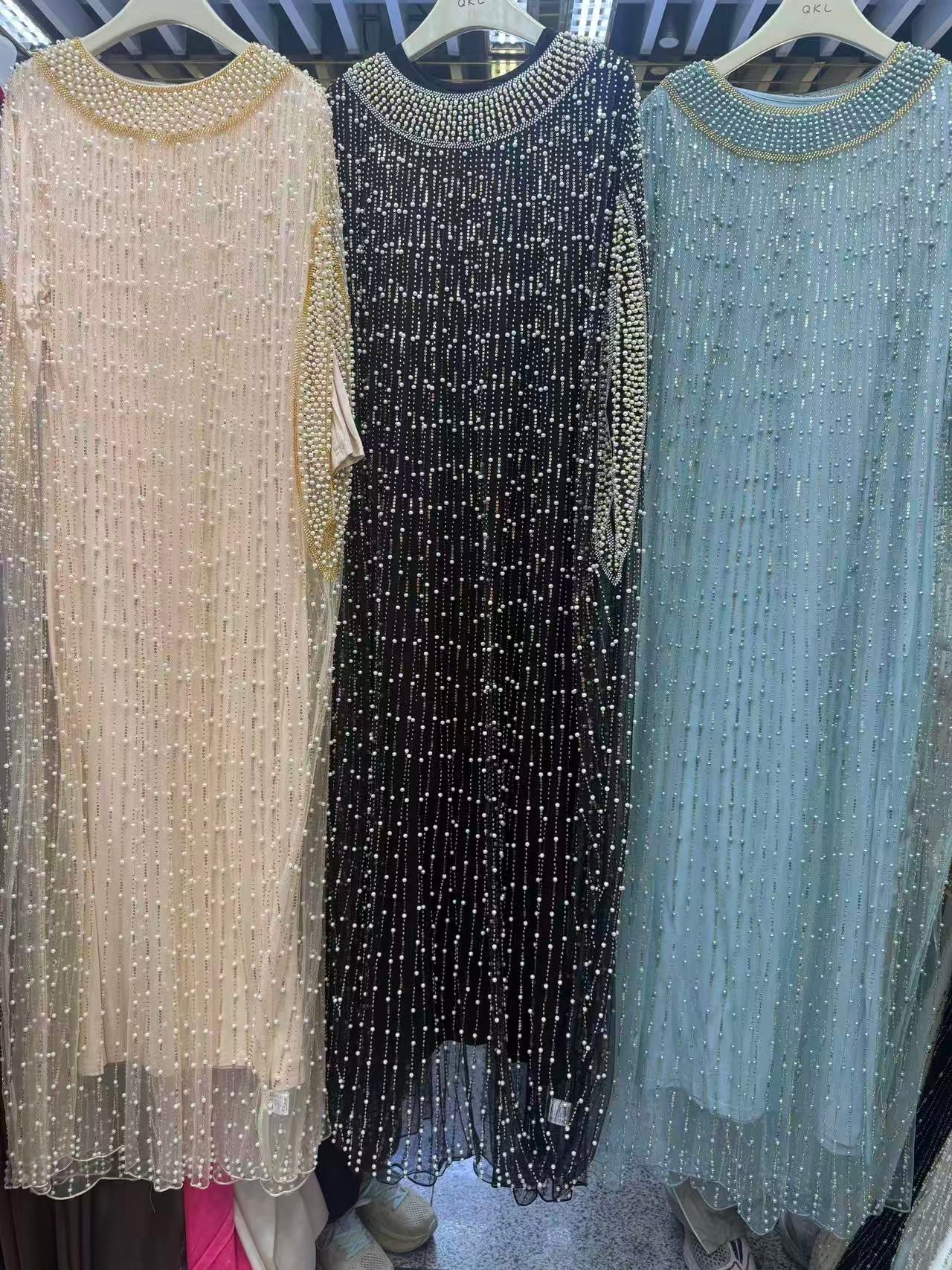 Elegant Pearl Dress Featuring Delicate Beaded Detailing Throughout.