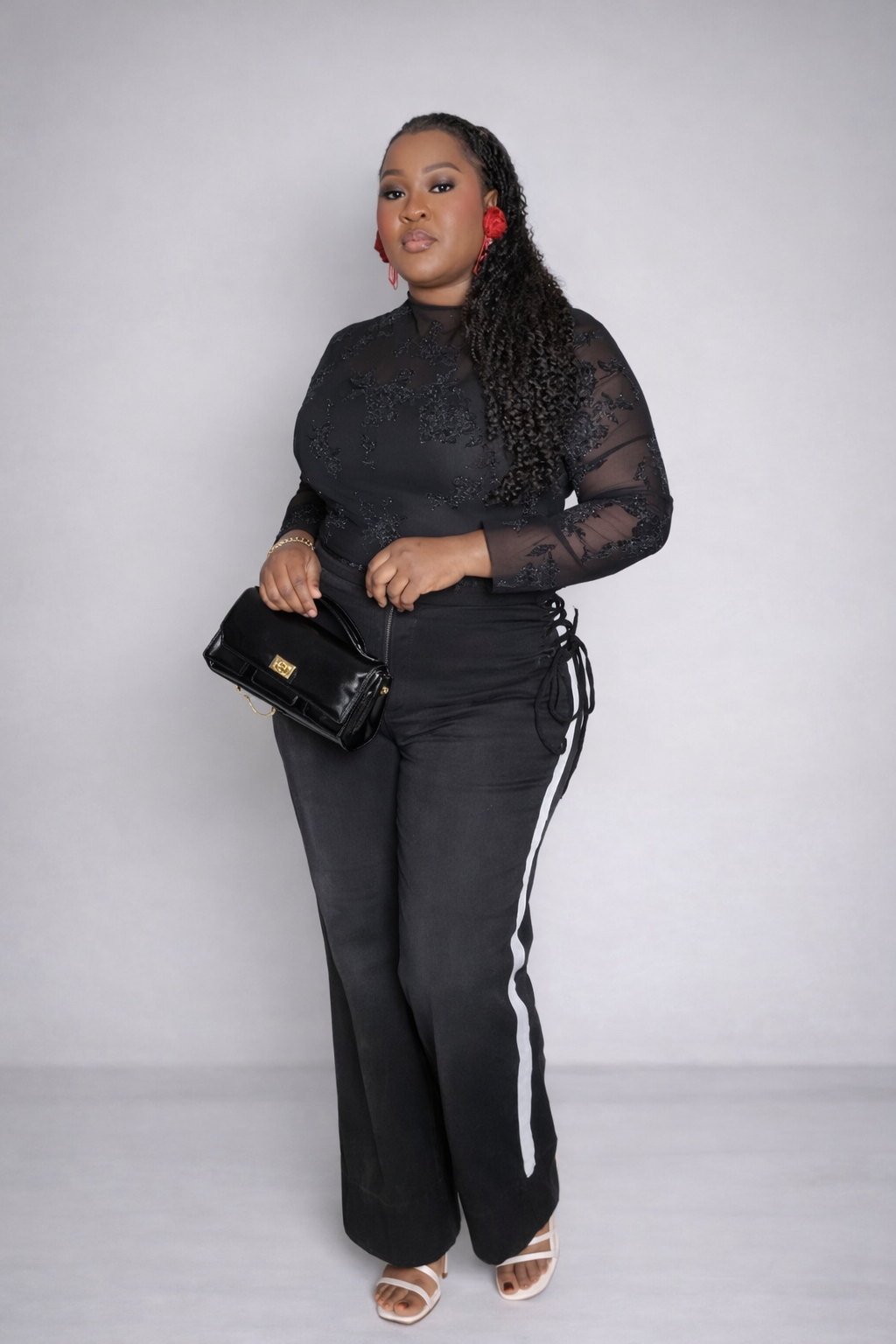 High-waisted black wide-leg jeans featuring