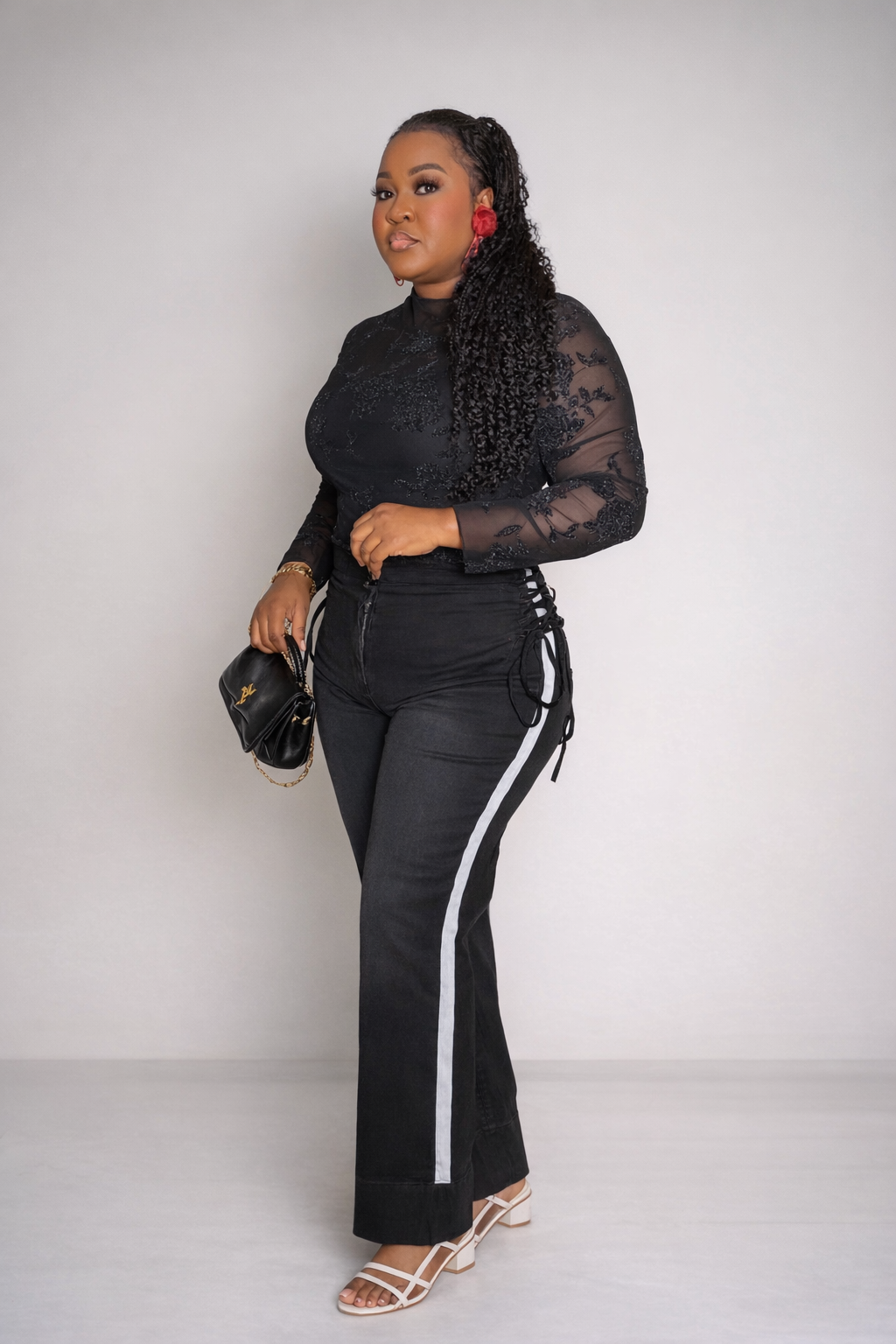 High-waisted black wide-leg jeans featuring